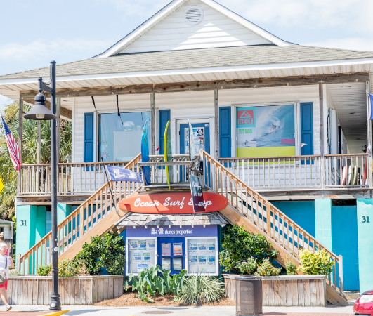 Bachelorette group next to the giant shark on Center Street in Folly Beach